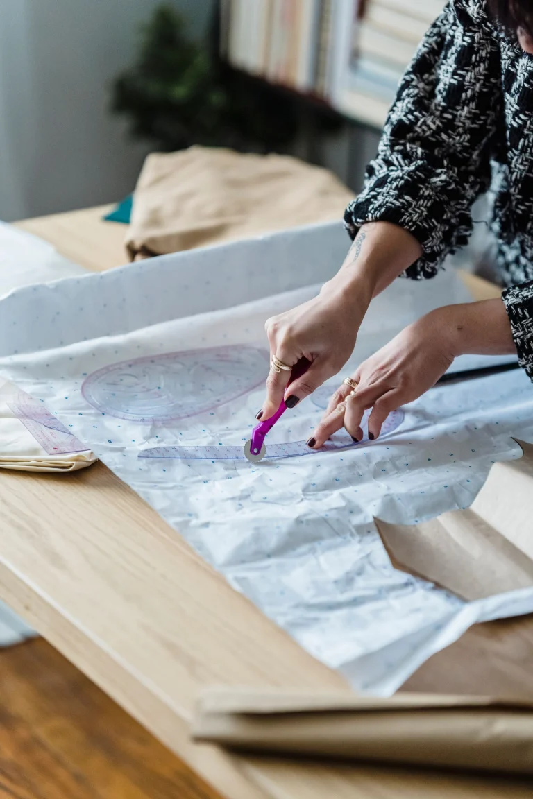 Cutting a garment pattern on the cutting table
